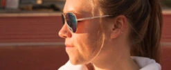 Tifosi Optics Shwae Aviator Sunglasses -CaddiesShack Sales Store woman wearing shwaegold 553x227 1
